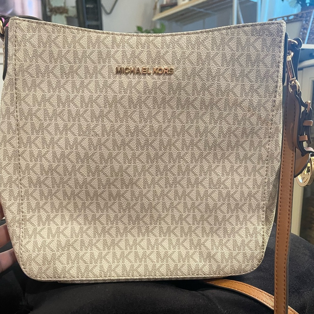 Medium sized light white with beige inside shoulder purse. Barely used.